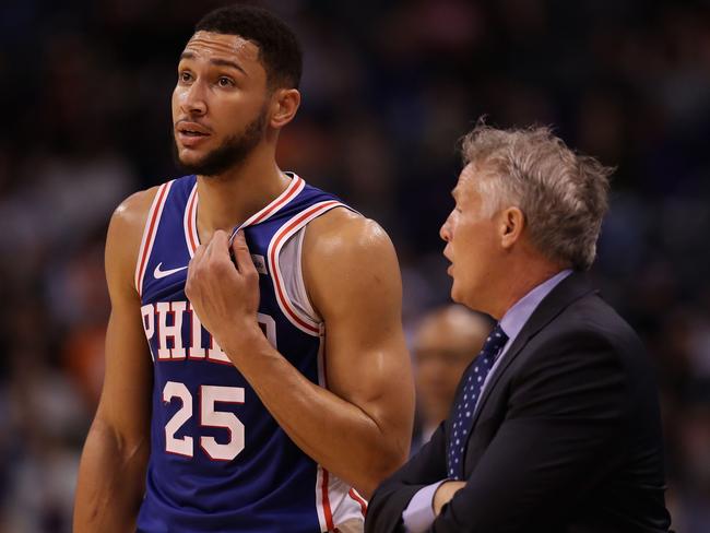 PHOENIX, ARIZONA - NOVEMBER 04: Ben Simmons #25 of the Philadelphia 76ers talks with head coach Brett Brown during the first half of the NBA game against the Phoenix Suns at Talking Stick Resort Arena on November 04, 2019 in Phoenix, Arizona. NOTE TO USER: User expressly acknowledges and agrees that, by downloading and/or using this photograph, user is consenting to the terms and conditions of the Getty Images License Agreement   Christian Petersen/Getty Images/AFP == FOR NEWSPAPERS, INTERNET, TELCOS & TELEVISION USE ONLY ==