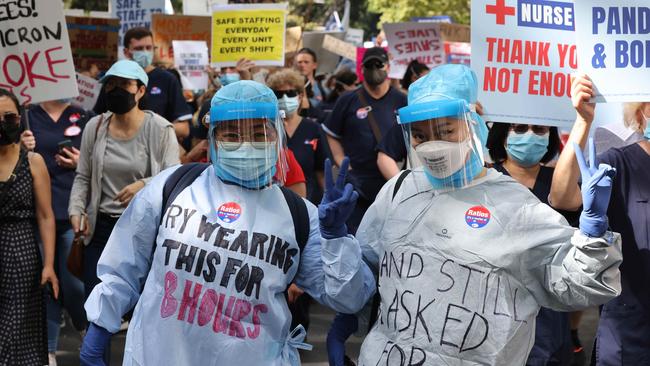 Note the “thank you is not enough” sign behind them. Picture: David Swift/NCA NewsWire