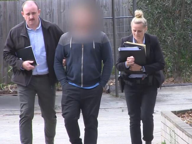 Police arrest a man during a child porn blitz across Melbourne and Victoria. Source: Victoria Police