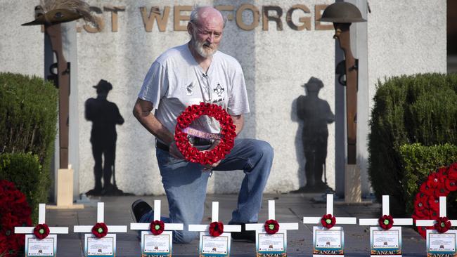 Mic Noble with the crosses he made for ANZAC DAY at the Logan Central memorial. The service has been cancelled but he will be organising an online tribute. AAP/Image Sarah Marshall)