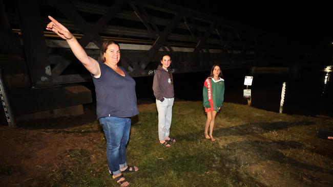 Forbes local Kerry Walker, with her daughters Iris, 13, and Audrey, 12, were out late on Tuesday evening inspecting the rising waters levels. Picture: Gary Ramage