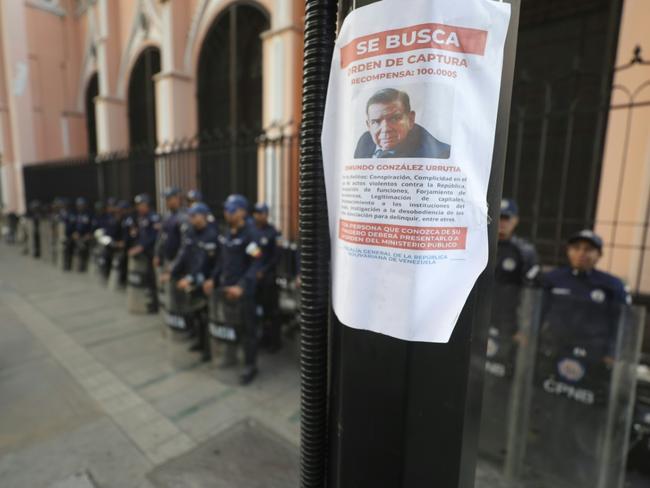 'Wanted' posters offering a $100,000 government reward for Edmundo Gonzalez Urrutia's capture were pasted on street signs around the capital