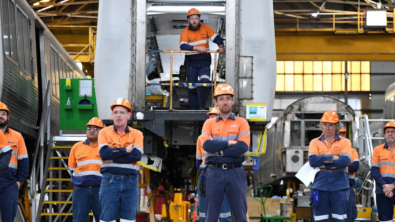 Workers watch as former Queensland Premier Annastacia Palaszczuk speaks during a 2020 visit to the Downer train building facility. Picture: NewsWire / Dan Peled