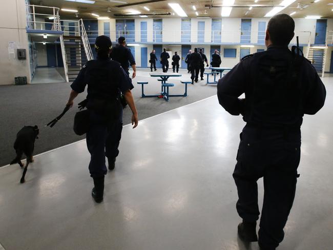 Corrective Services officers raid cells at Silverwater Jail looking for contraband. The officers now wear body cams that record the raids. Picture: Richard Dobson