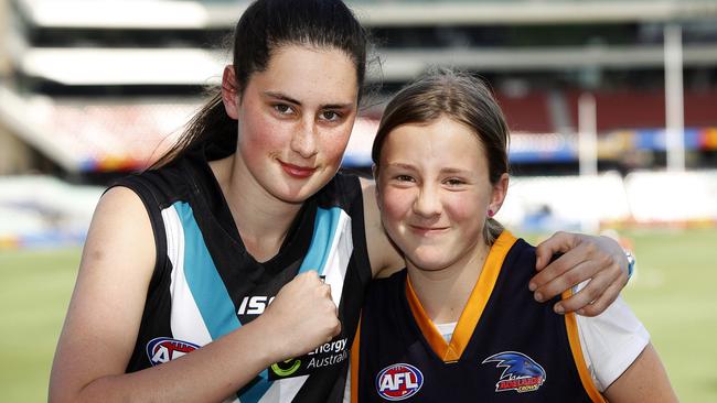 Friends Amy Czernich-Pearce (18) &amp; Bethany Bell (12) at the Little Heroes Foundation's flagship event West End Showdown, at Adelaide Oval. picture: Bianca De Marchi