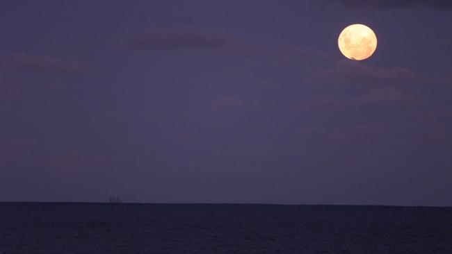 The moon rises over the waters off Wye River after the drug bust. Picture: Phillip Stubbs