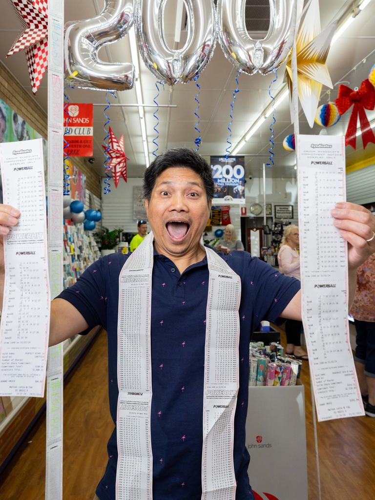 Melton Tatts shop Phong Thai people queuing to buy tickets to Thursday's draw. Picture: Jason Edwards