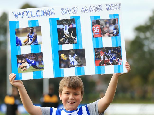 North fan Darcy Turcinovich, 10, made a welcome back poster “so he can have good luck for the game”. Picture: Mark Stewart