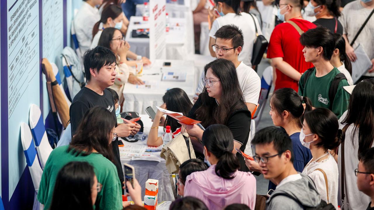 University graduates attend a job fair in Wuhan, after China said it would suspend the release of youth unemployment rates. Picture: AFP