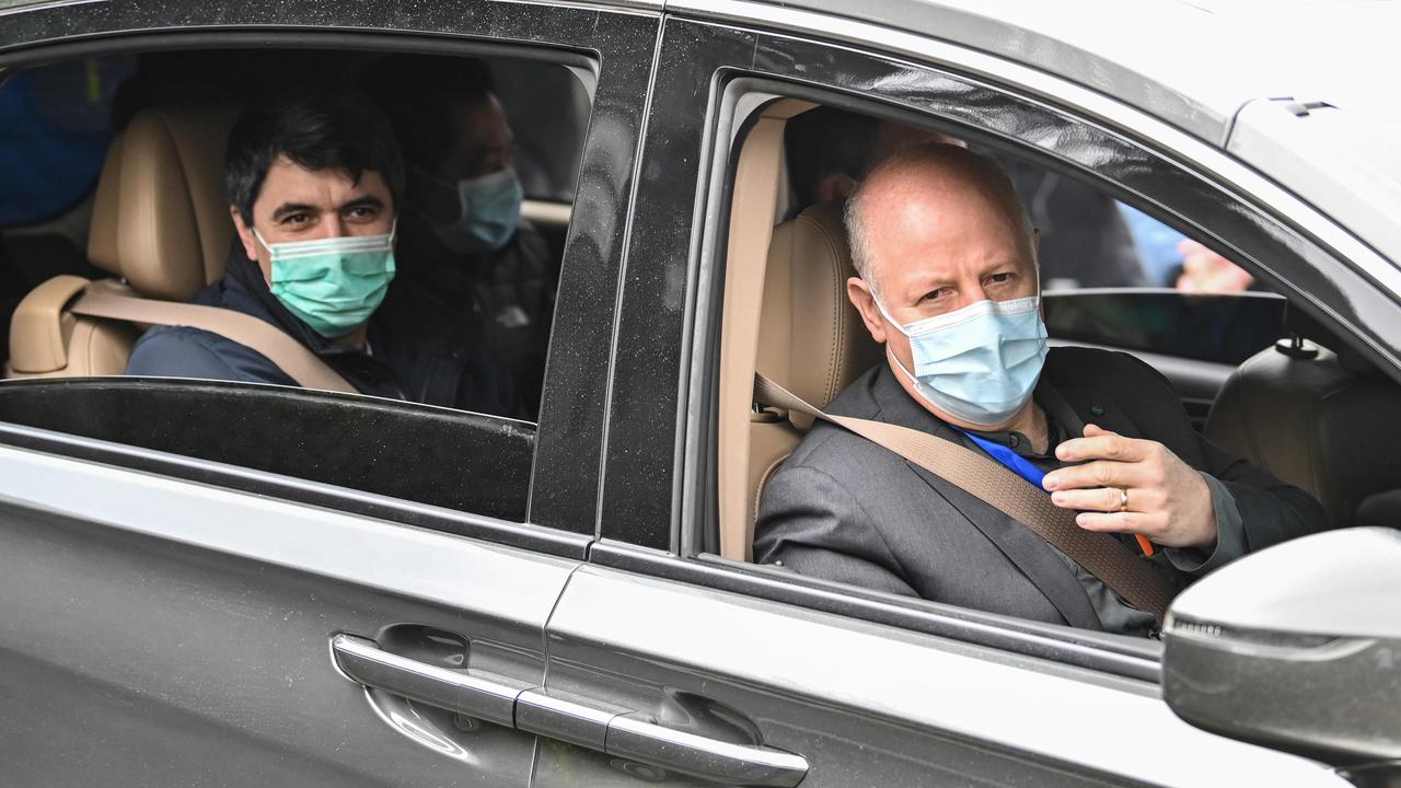 Dr Peter Daszak, right, in Wuhan on February 2. Picture: Hector Retamal/AFP