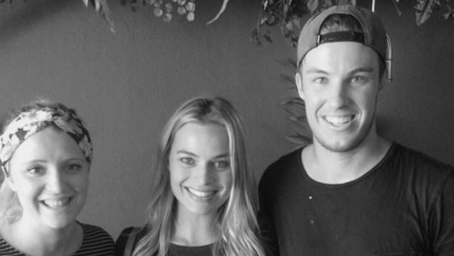 Margot Robbie (centre) drops in at Elk Espresso during her brief return home to the Gold Coast.