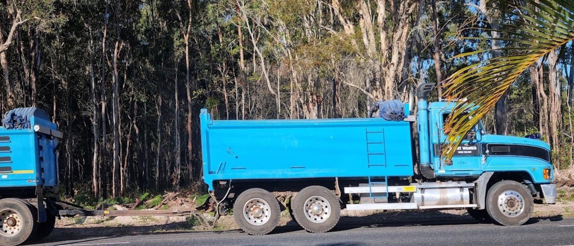 An uncovered truck in the Burrum Heads area delivering dirt.