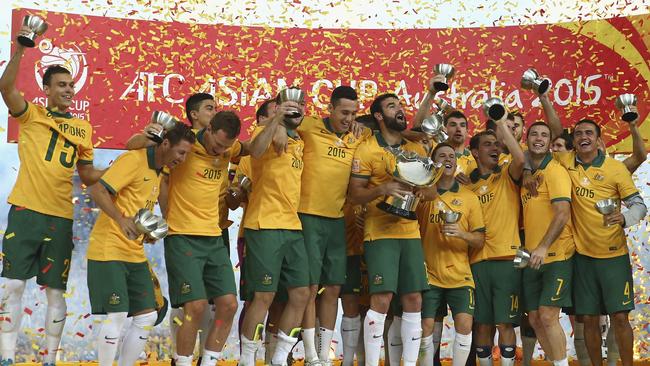 Australia celebrate with the Asian Cup trophy.