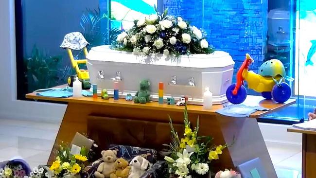 The casket of Henry George Spletter was decorated in white roses and his favourite toys. Picture: Supplied