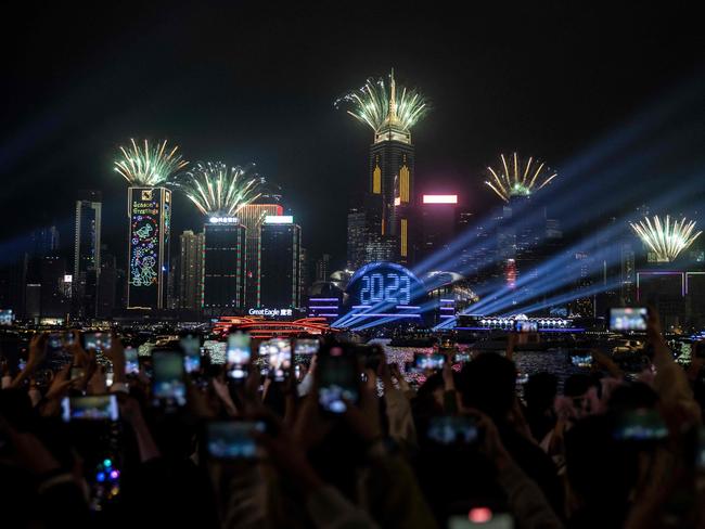 Hong Kong’s Victoria Harbour lights up. Picture: AFP