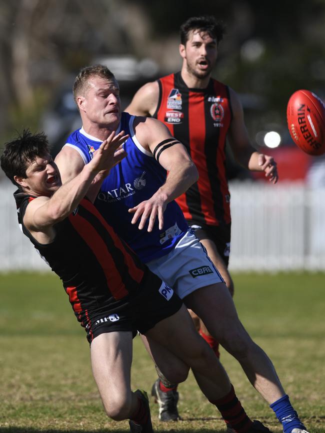 SPOC’s Jock McLeay and ROC’s Sam Jonas battle for the ball. Picture: Naomi Jellicoe