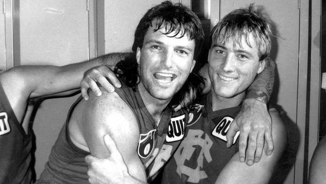 Richard Osborne celebrates a Fitzroy win with Paul Roos (left) in 1991.