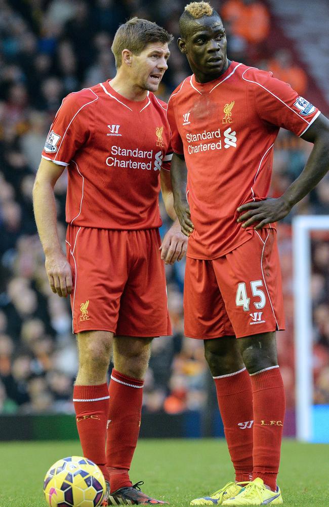 Mario Balotelli talks tactics with Steven Gerrard.