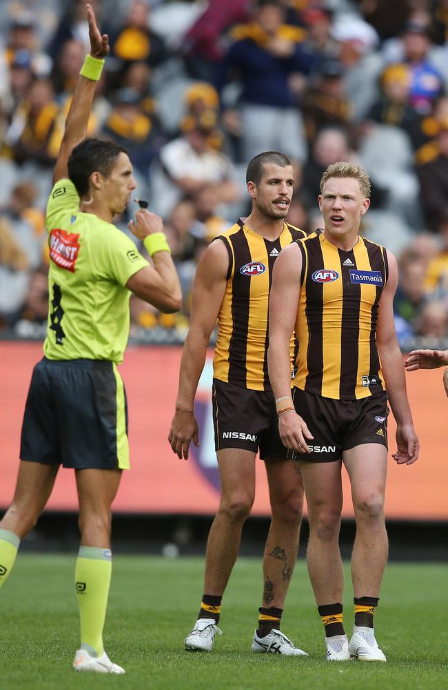 Hawthorn’s James Sicily looks at umpire Justin Power after giving away a free kick to Bulldog Josh Schache. Picture: Michael Klein