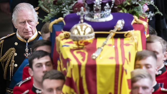 King Charles III follows behind the coffin of his mother, Queen ElizabethII, as it is carried out of Westminster Abbey in September. Picture: Getty Images