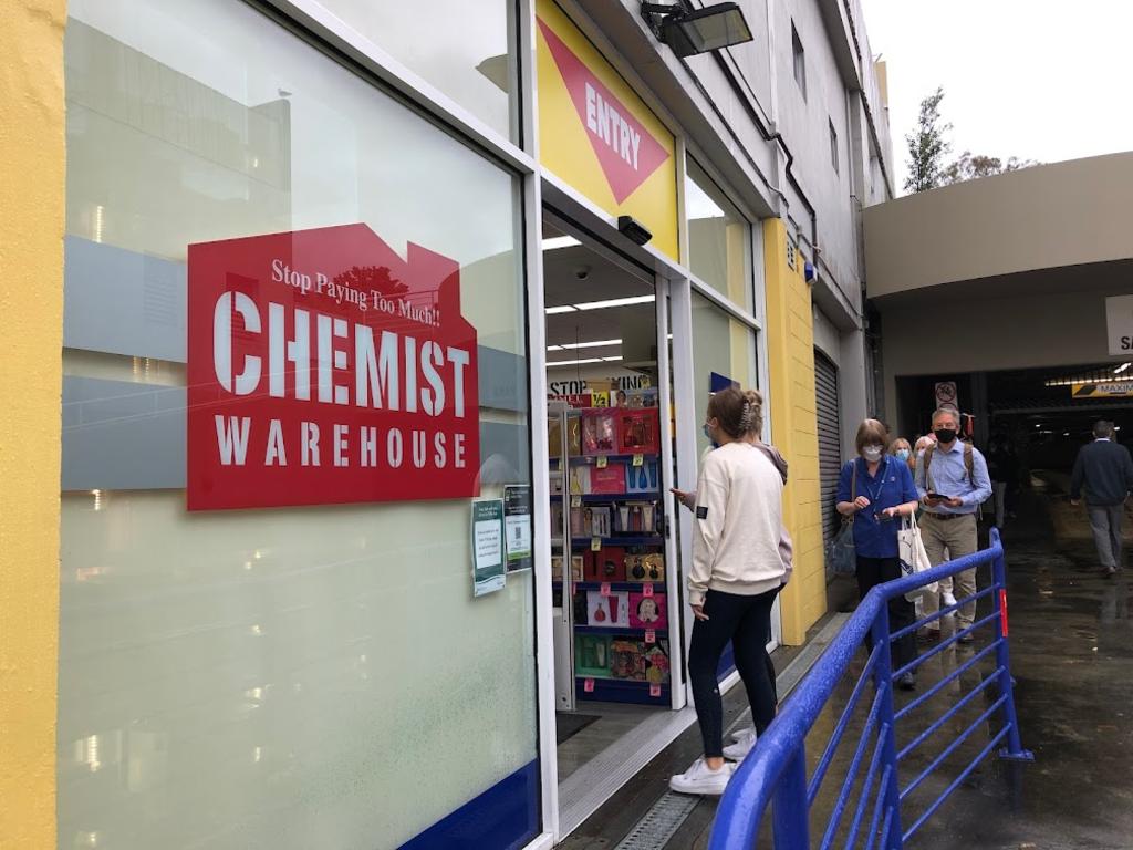 Customers line up at Chemist Warehouse in Salamanca in search of rapid antigen tests (RAT). Picture: Nikki Davis-Jones