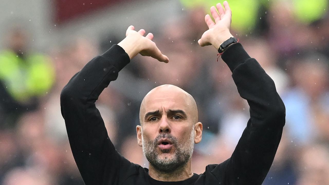 Manchester City's Spanish manager Pep Guardiola reacts during the English Premier League football match between West Ham United and Manchester City at the London Stadium, in London on May 15, 2022. (Photo by JUSTIN TALLIS / AFP) / RESTRICTED TO EDITORIAL USE. No use with unauthorized audio, video, data, fixture lists, club/league logos or 'live' services. Online in-match use limited to 120 images. An additional 40 images may be used in extra time. No video emulation. Social media in-match use limited to 120 images. An additional 40 images may be used in extra time. No use in betting publications, games or single club/league/player publications. /