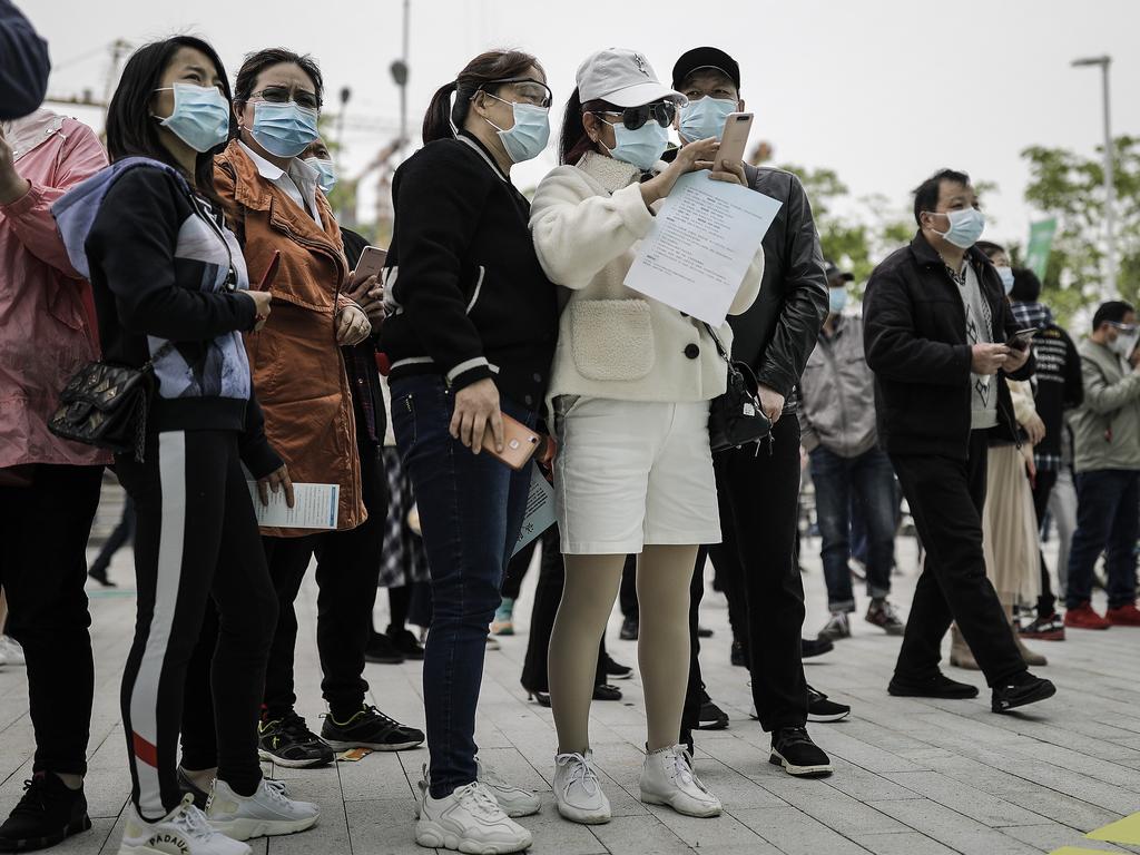 Job applicants read recruitment information at an on-site job fair on April 21, 2020 in Wuhan, China. Picture: Getty Images