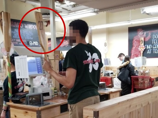 Cashiers hold up a paddle with their register number when they’re ready for another customer. Picture: Google