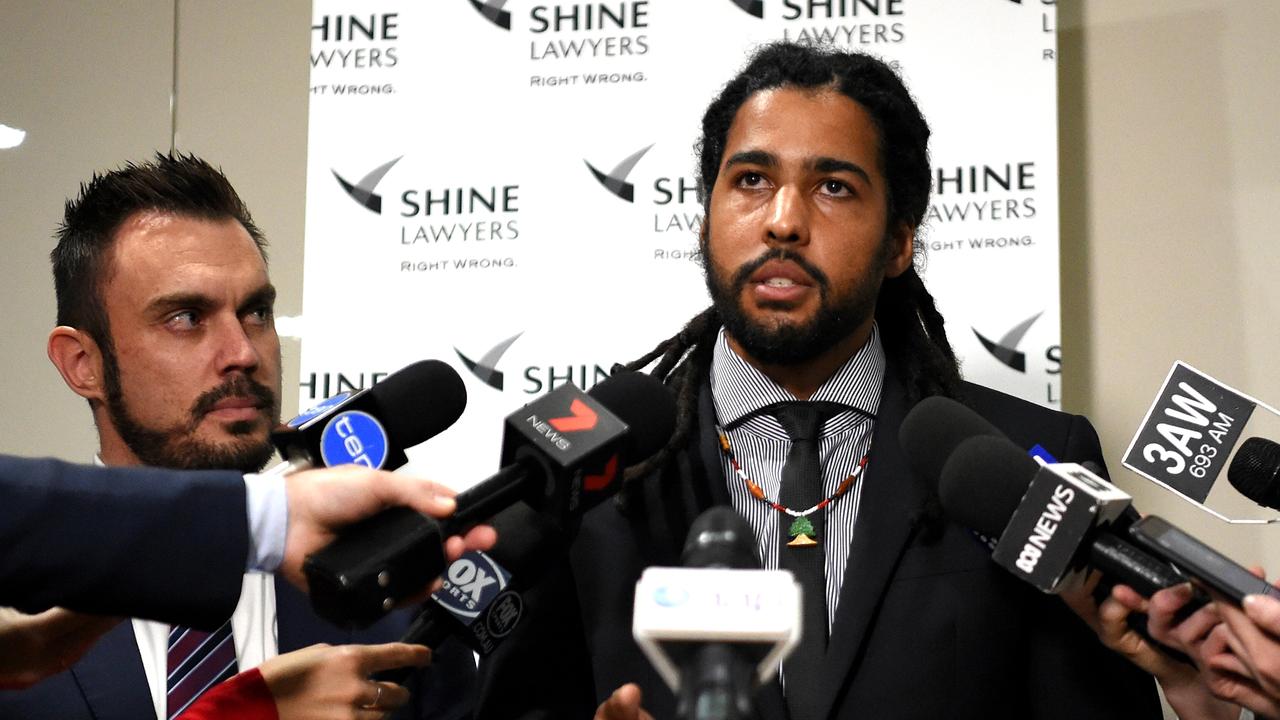 Joel Wilkinson Former AFL player suing for racial vilification and sexual harassment makes a statement to the media with Will Barsby employment law expert from Shine Lawyers. Picture: Nicole Garmston