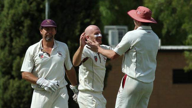 Matt Perri (centre) celebrates a wicket in last summer’s NMCA Jika Shield grand final. Picture: Hamish Blair