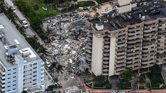 In this aerial view, search and rescue personnel work on site after the partial collapse of the Champlain Towers South in Surfside, north of Miami Beach.