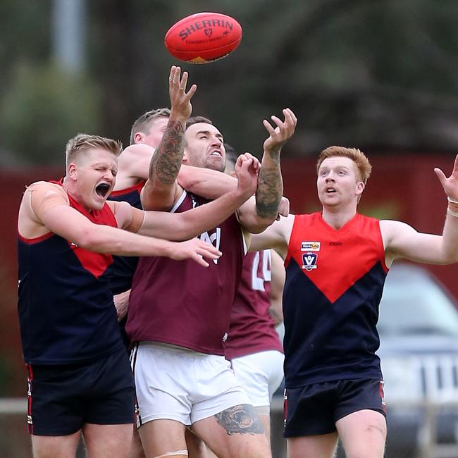 Nullawil ruckman Dean Putt is surrounded by Wycheproof-Narraport opponents.