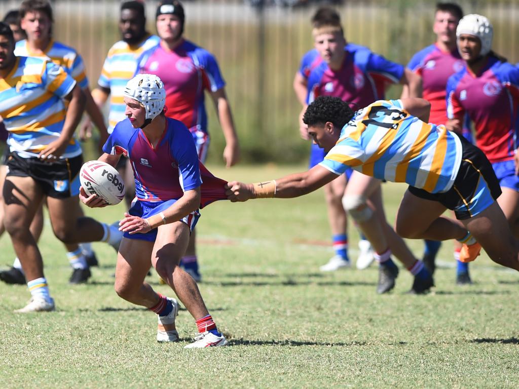 Boys Rugby League State Championship held at Northern Division, Brothers Leagues ground, Townsville. 16-18 years. Peninsula (stripe) v Darling Downs (blue/purple). Braithen Scott of St Mary's College, Toowoomba.