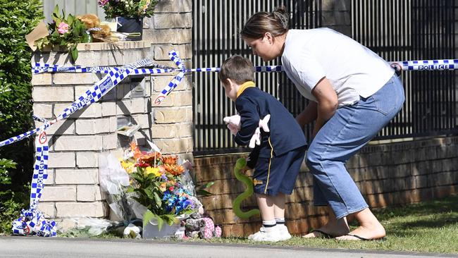 Community members leave floral and soft toy tributes following a triple fatal house fire in Harristown, Friday, May 9, 2025. Picture: Kevin Farmer