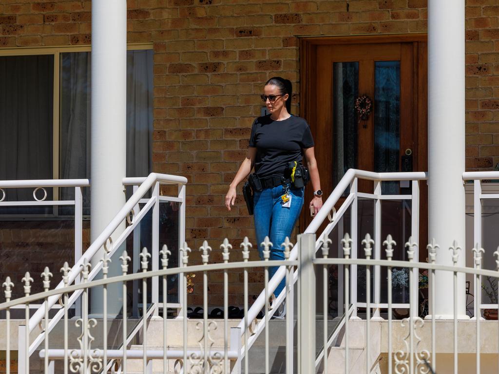 Polcie at the Narwee address yesterday, a day after arresting the alleged mastermind of the encrypted communication device Ghost. Picture: Justin Lloyd.