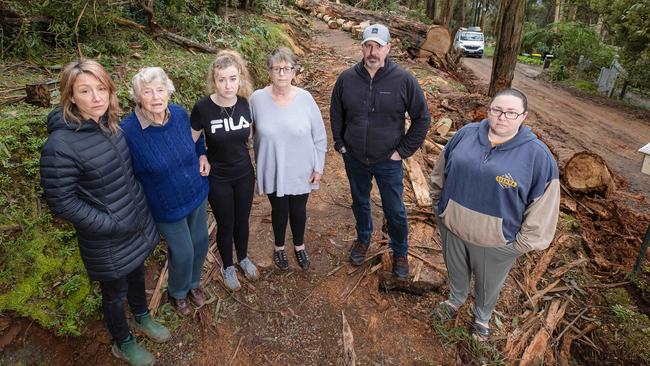 Inverness Rd neighbours Lilly Markovic, 46, Merlin Edgar, 89, Rose Henderson, 63, Kinley, 16, and Jess Czmok, 35, will be without power for weeks. Picture: Jason Edwards