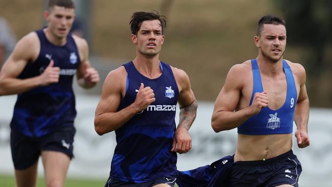 Jy Simpkin (left) and Luke Davies-Uniacke hit the track at Arden Street. Picture: Michael Klein