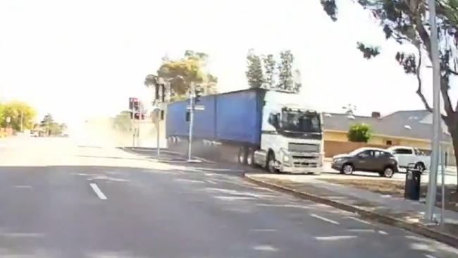 The truck narrowly missed a car as it sped through an intersection. Picture: 9News/Channel 9