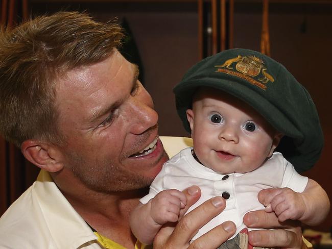 SYDNEY, AUSTRALIA - JANUARY 10:  David Warner of Australia poses with his daughter Ivy in the change rooms after day five of the Fourth Test match between Australia and India at Sydney Cricket Ground on January 10, 2015 in Sydney, Australia.  (Photo by Ryan Pierse - CA/Cricket Australia via Getty Images/Getty Images)