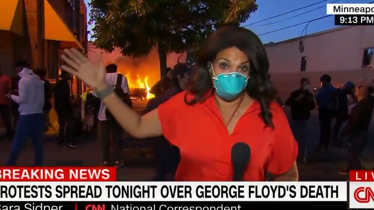 CNN reporter Sara Sidner reports live from Minneapolis as protesters ignore the 8pm curfew and a car burns in the background.