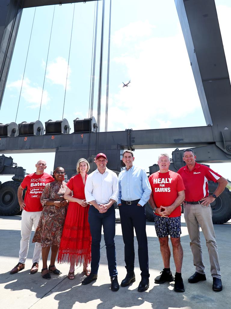 Labor candidate for Mulgrave Richie Bates, Member for Cook Cynthia Lui, Minister for Health Shannon Fentiman, Queensland Premier Steven Miles, Treasurer Cameron Dick, Member for Cairns Michael Healy and Member for Barron River Craig Crawford stand between the giant gantries of a shiplift in the Austal shipyard, Cairns. Picture: Brendan Radke