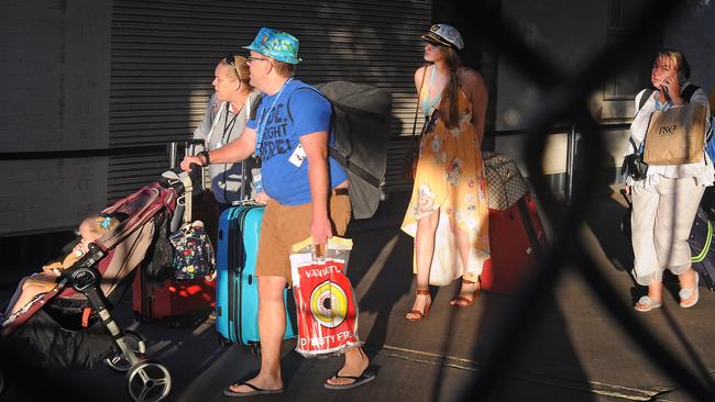 Passengers great family and friends after disembarking from the Pacific Dawn in Brisbane on Sunday morning. Picture: AAP / John Gass.