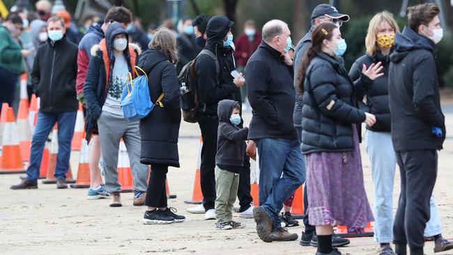 Residents at a Southbank apartment block line up for testing after their neighbours were infected this week. Picture: NCA NewsWire/David Crosling