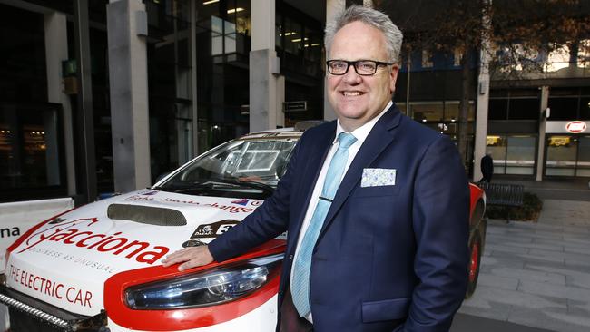 Acciona Australia energy managing director Brett Wickham with the company's electric powered rally car to Australia. The car was the first all electric vehicle to compete the Dakar Rally last year. It is in Australia taking part in the Finke Desert Race at Alice Springs in June  Picture: David Caird