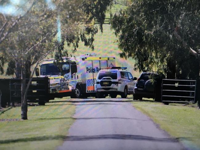 Police vehicles block the entrance to the property on which the accident occurred. Picture: Peter Lorimer