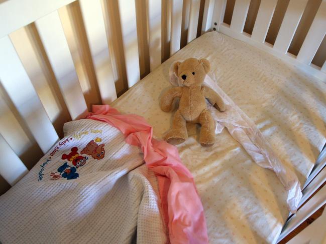 Generic photo of an empty baby cot or young child's bed.