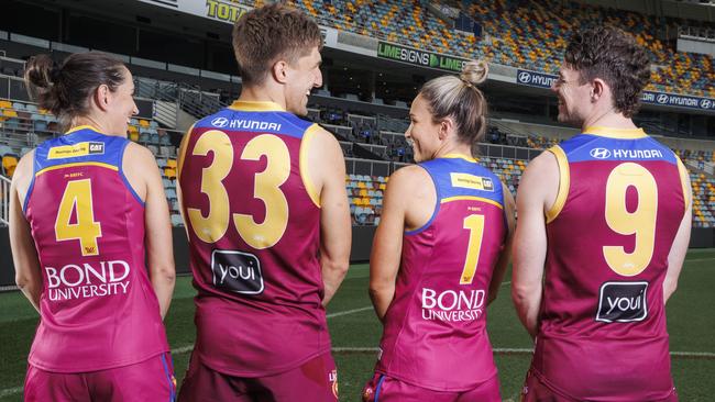 Lions players Sharni Webb, Zac Bailey, Emily Bates and Lachie Neale make up the Brisbane Lions record breaking number of 43,319 memberships bought in 2022. Picture Lachie Millard