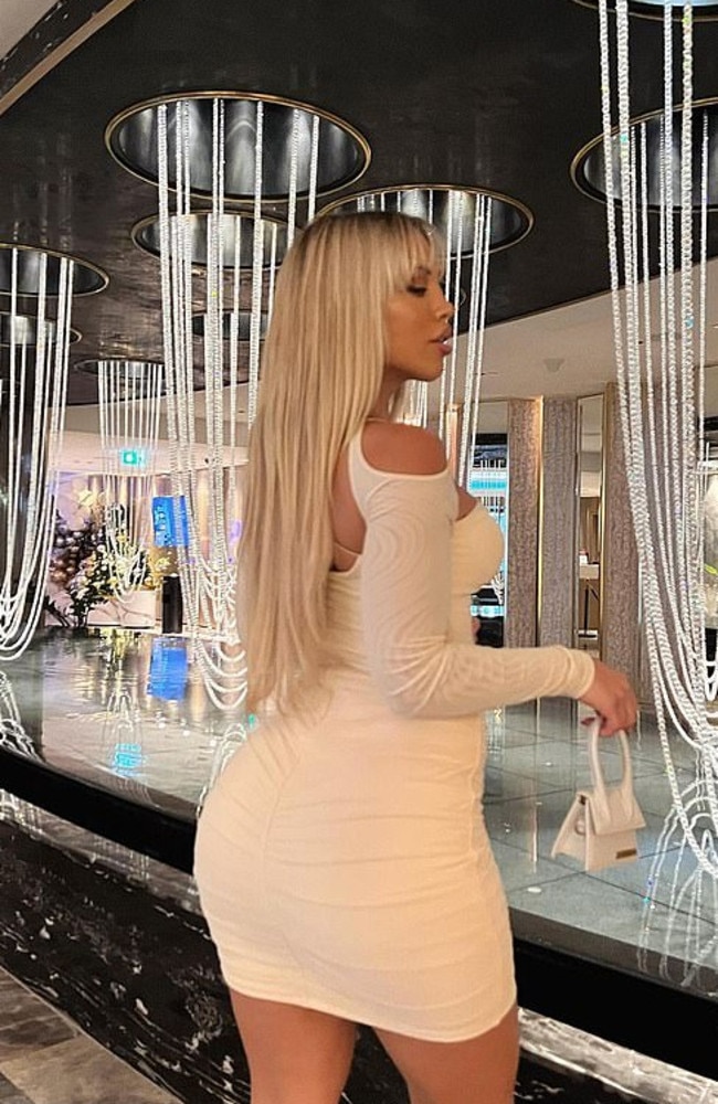 The fitness star, who was at fashion label Oh Polly’s Christmas party, showed off her famous behind. Picture: Instagram/TammyHembrow