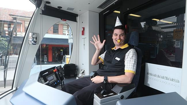 G:link driver Jake Deguara gets the party started to mark two hugely successful years since the trams began rolling on the Gold Coast. Picture: GLENN HAMPSON