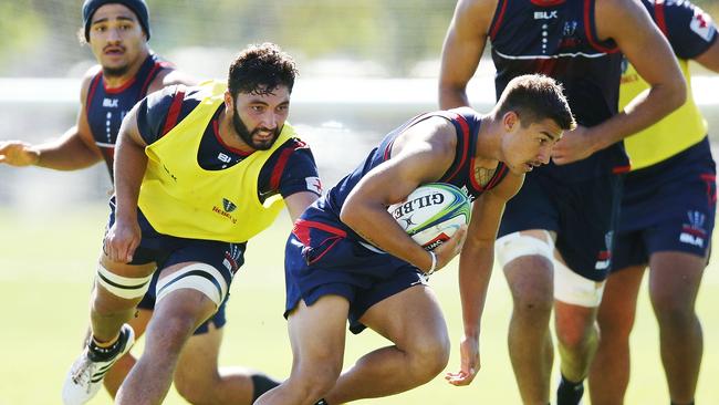 Harrison Goddard runs with the ball during a Melbourne Rebels Super Rugby training session back in 2018.